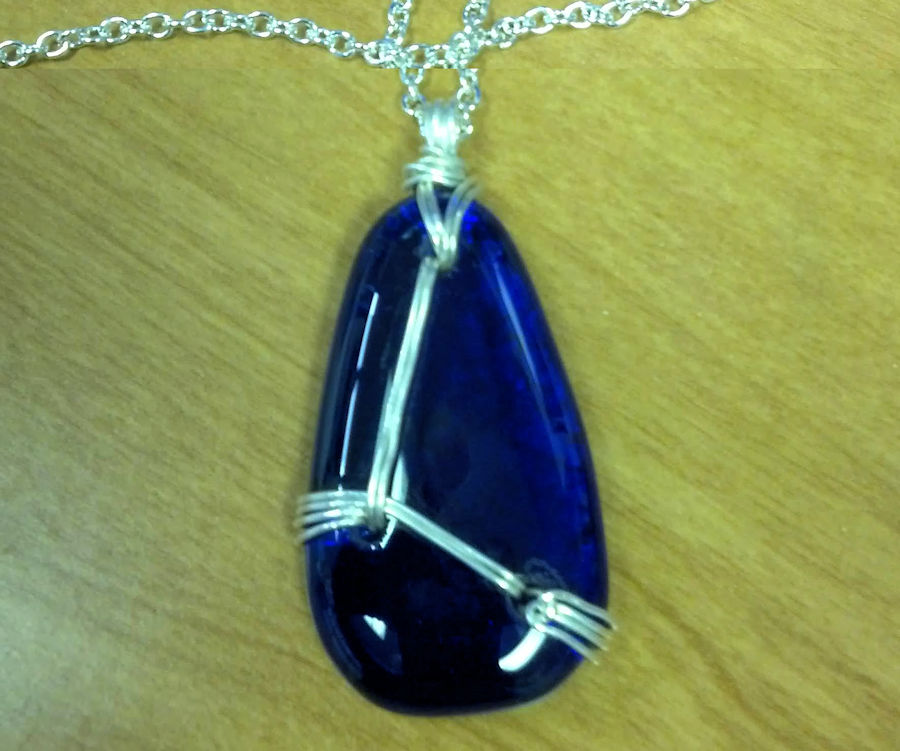 This was my first fused pendant, drilled 3 holes and wrapped in silver wire